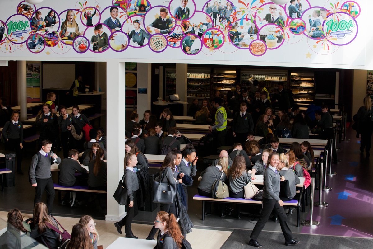 A photo of students in the cafeteria seating area