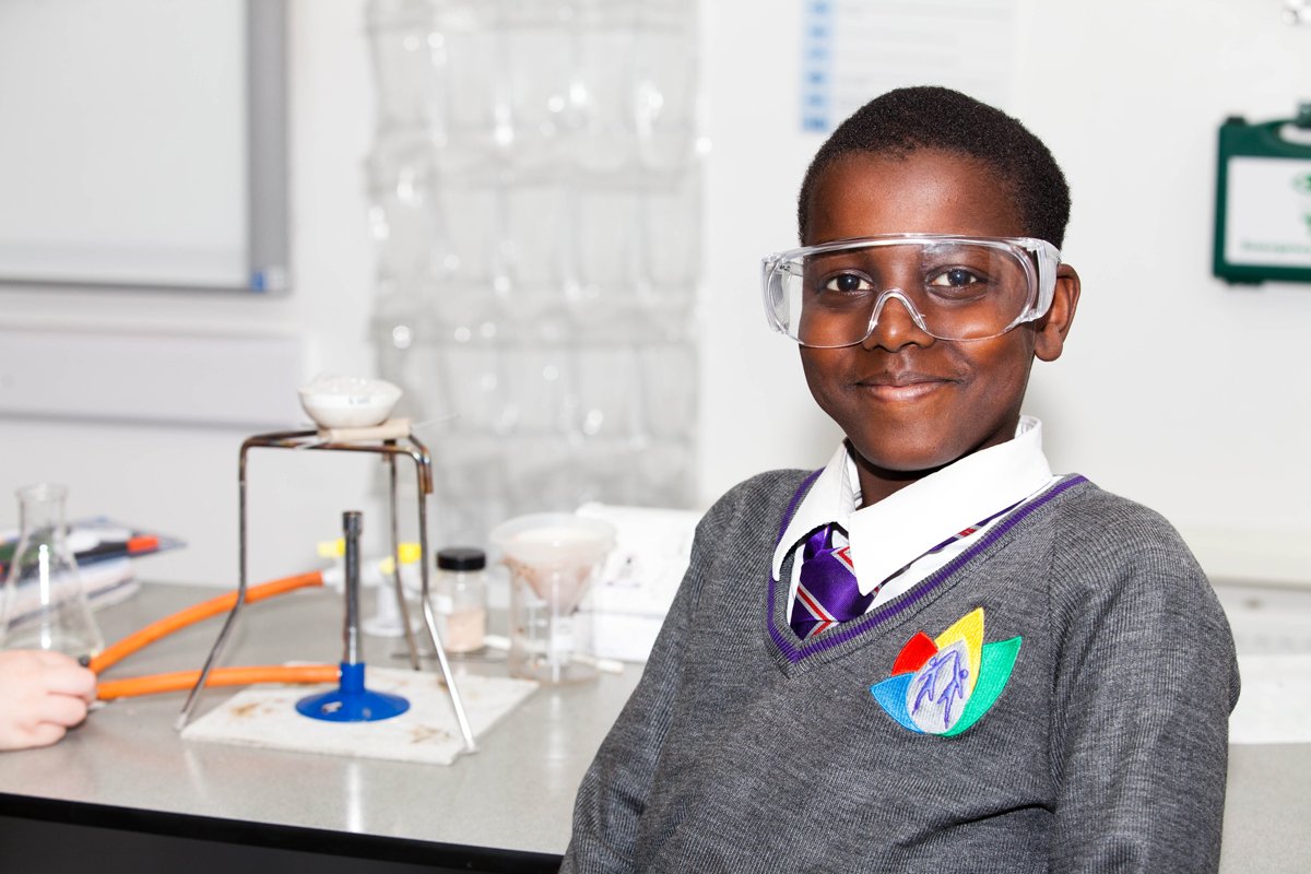 A student sat in a science lesson wearing protective glasses