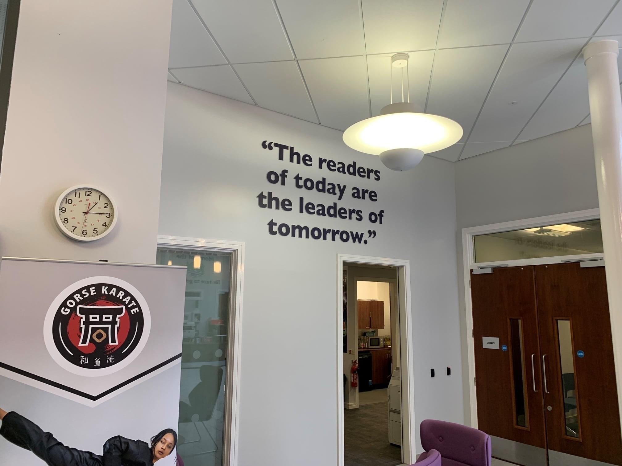 A quote above a doorway “The readers of today are the leaders of tomorrow“